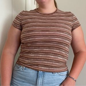 Brown and white striped short sleeved shirt.